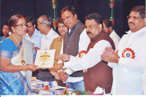 Mrs. Sudha Nair receiving Mayor's Award
